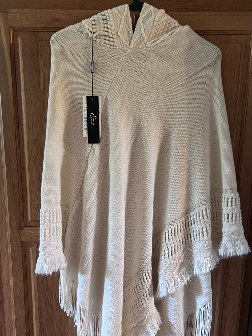 Cozy poncho. One size. Light cream colored